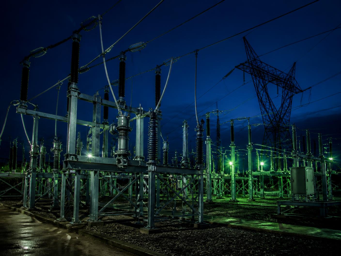 High voltage electricity substation supplying UK businesses at dusk
